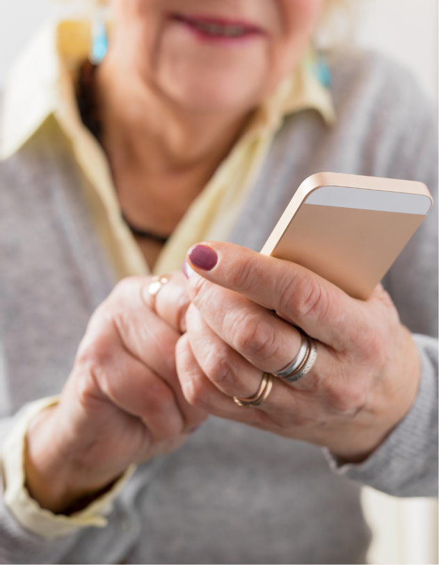 older white woman using smart phone